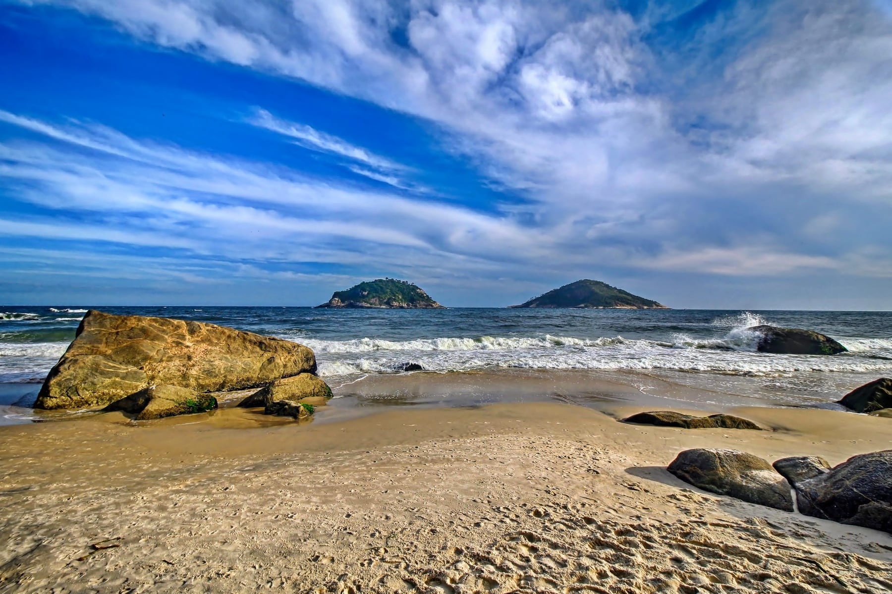 Atlantic shoreline and rocky headland at Praia do Abricó in Grumari, photographed without any beach visitors