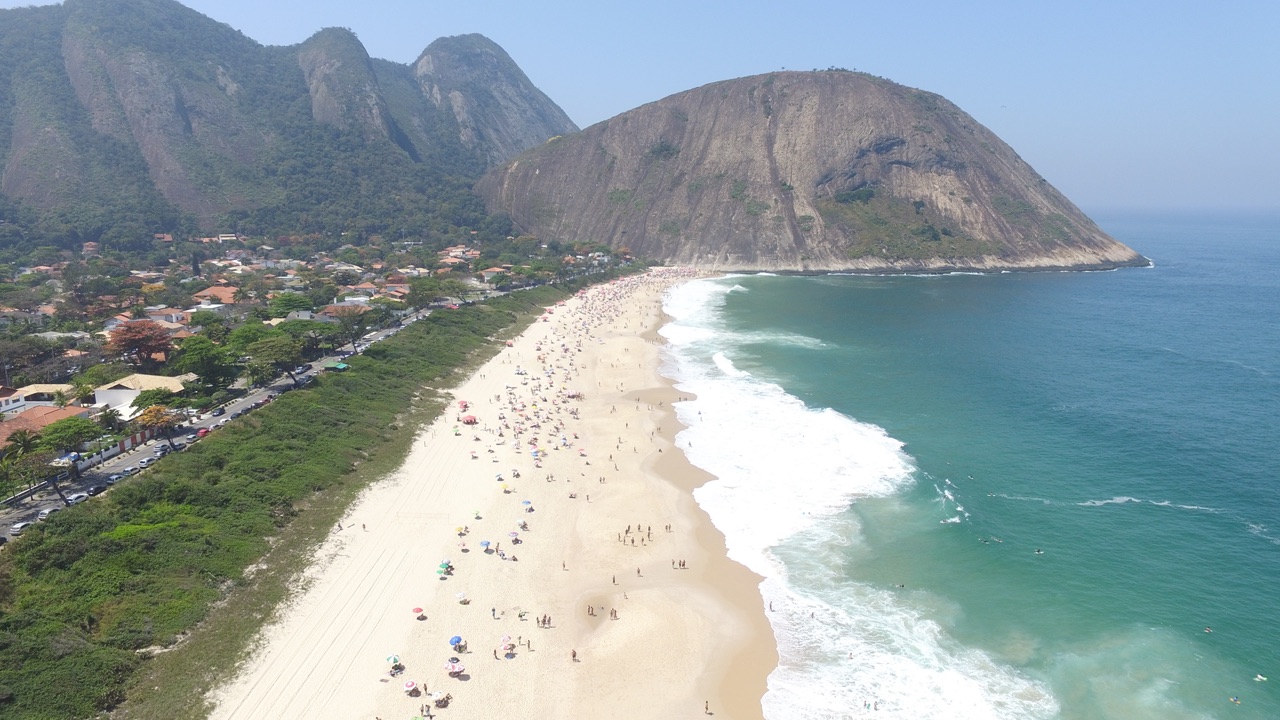 Aerial view of Itacoatiara Beach, its Atlantic surf and the Costão granite headland in Niterói